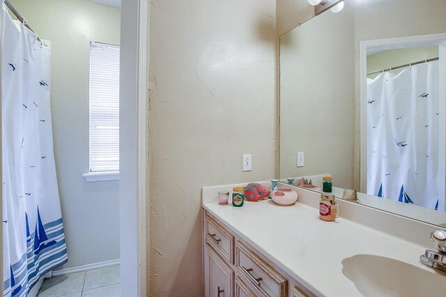 bathroom with vanity and tile patterned flooring