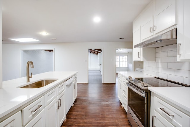 kitchen featuring sink, white cabinetry, dark hardwood / wood-style floors, stainless steel electric stove, and decorative backsplash