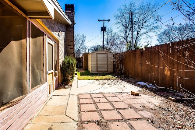 view of patio featuring a storage shed