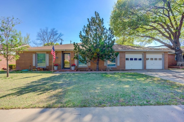 single story home featuring a garage and a front lawn