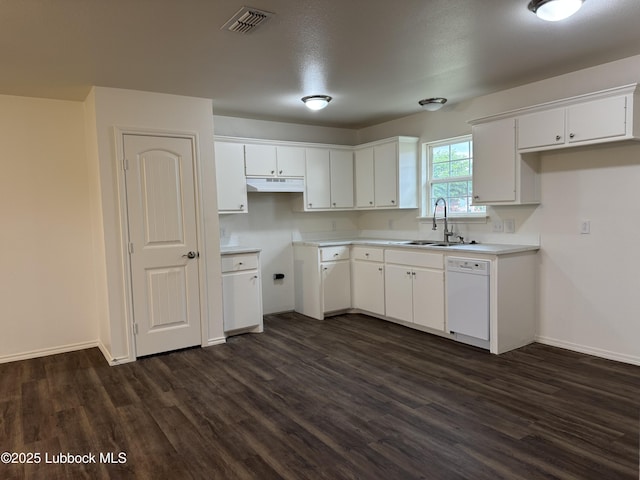 440 W Scott St, Slaton, TX 79364 - kitchen with white dishwasher, a sink, under cabinet range hood, and dark wood-type flooring