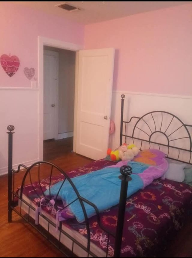 bedroom featuring hardwood / wood-style floors