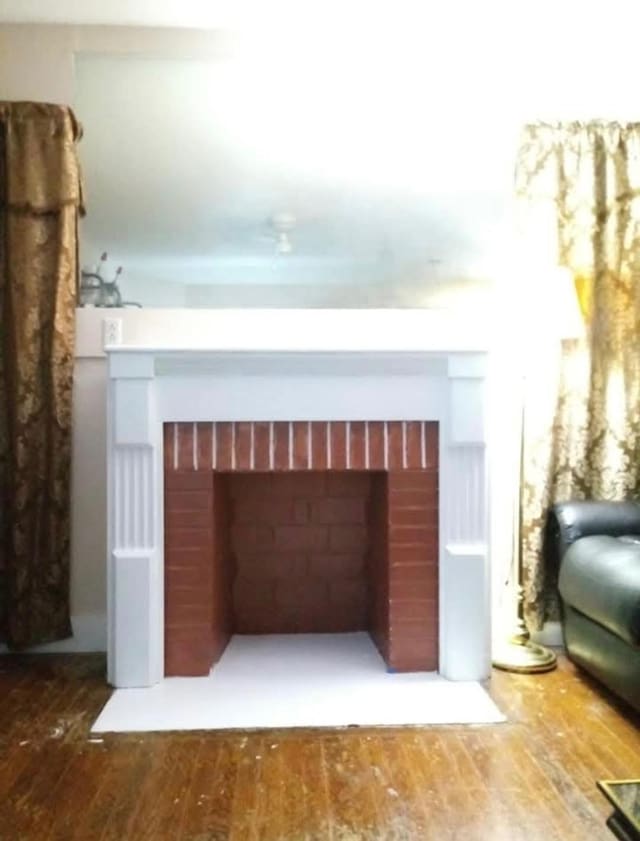 interior space featuring wood-type flooring and a fireplace