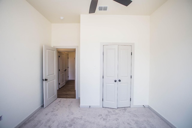 1312 Chaucer Ln, Wolfforth, TX 79382 - unfurnished bedroom with light carpet, ceiling fan, and a closet