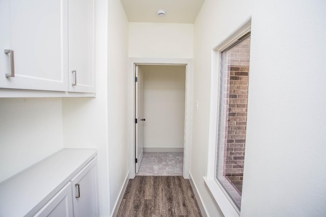 1312 Chaucer Ln, Wolfforth, TX 79382 - corridor with baseboards and dark wood-style flooring