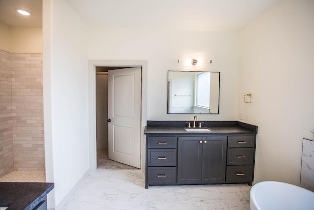 1312 Chaucer Ln, Wolfforth, TX 79382 - full bath with vanity, marble look tiles, a freestanding tub, and a tile shower