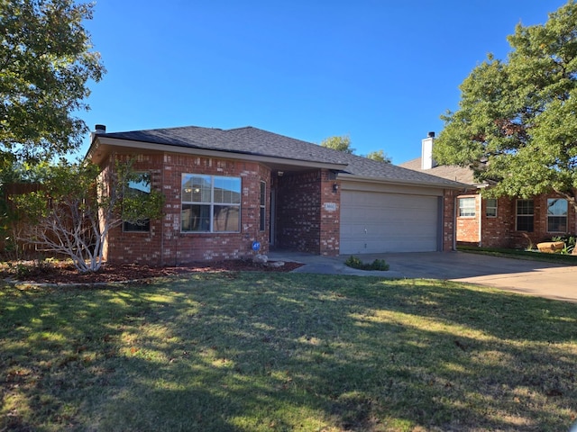 view of front facade with a garage and a front lawn