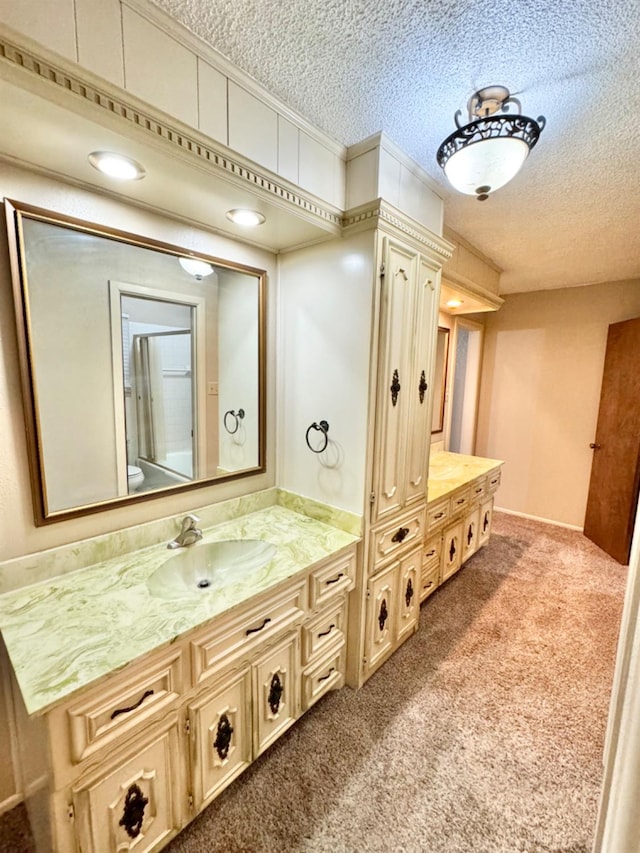 bathroom with vanity and a textured ceiling