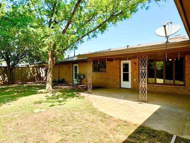 back of property featuring a patio