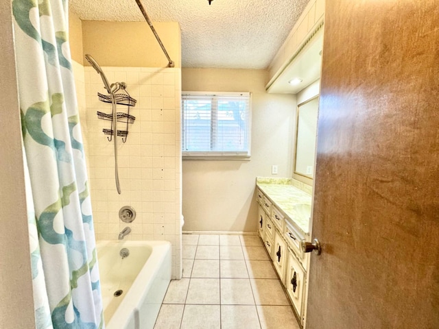 bathroom with vanity, tile patterned floors, a textured ceiling, and shower / bath combo with shower curtain