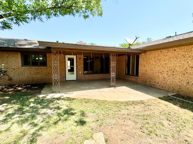 back of house featuring a patio area