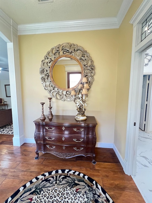 interior details featuring crown molding and hardwood / wood-style floors