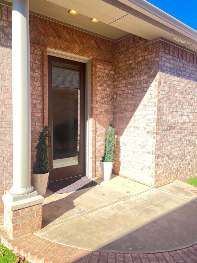 view of exterior entry featuring a porch