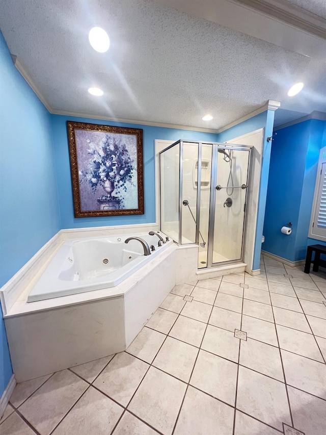 bathroom featuring tile patterned floors, ornamental molding, a textured ceiling, and separate shower and tub