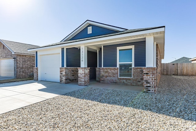 view of front of house featuring a garage and covered porch