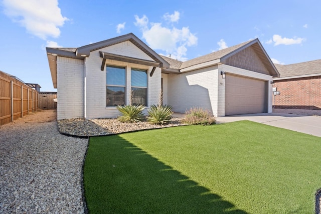 view of front facade featuring a garage and a front lawn