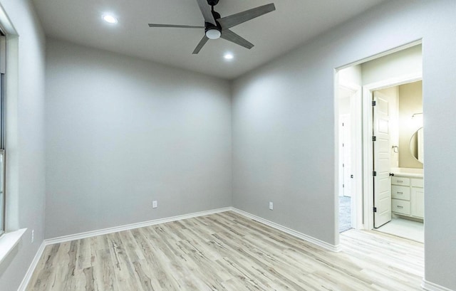 spare room with ceiling fan and light hardwood / wood-style flooring