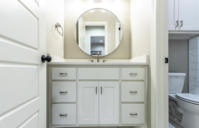 bathroom with vanity and toilet