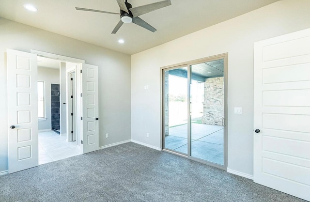 unfurnished bedroom with access to outside, light colored carpet, and ceiling fan