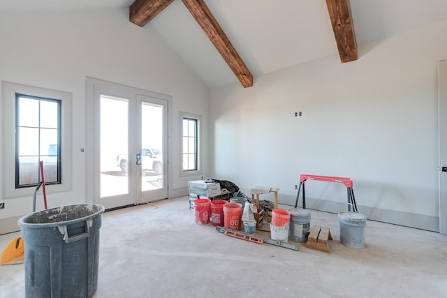 interior space with french doors and lofted ceiling with beams