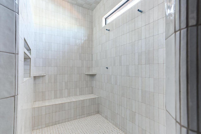 full bathroom with a tile shower