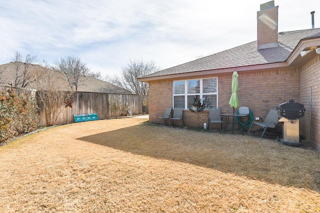 view of yard with a fenced backyard