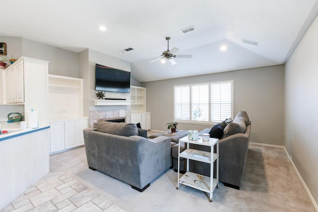 living room featuring ceiling fan and lofted ceiling