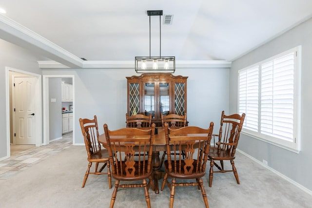 dining area with plenty of natural light and light colored carpet