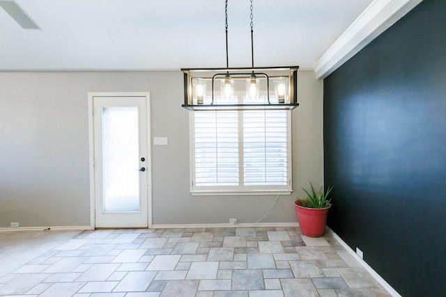 unfurnished dining area featuring ornamental molding