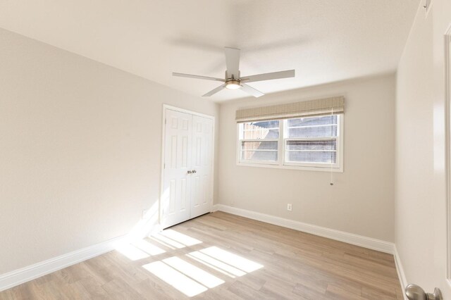 spare room with ceiling fan and light hardwood / wood-style flooring