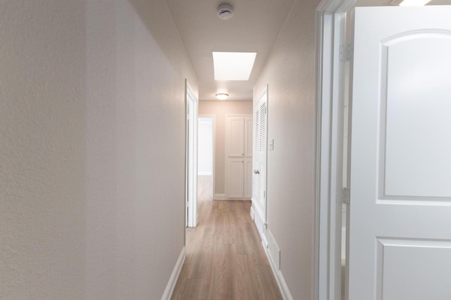 corridor featuring light hardwood / wood-style flooring