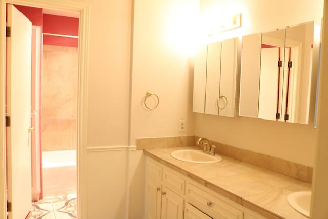 bathroom featuring vanity and bathtub / shower combination