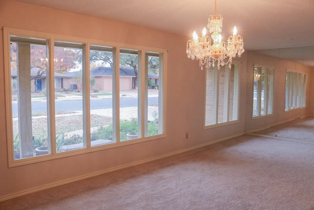 interior space featuring carpet floors and a notable chandelier