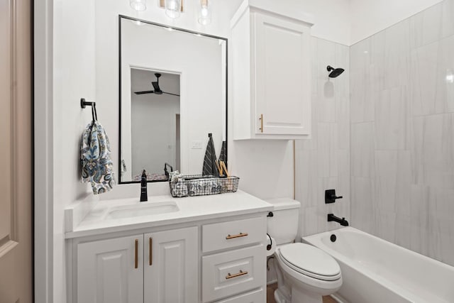 full bathroom featuring vanity, toilet, and tiled shower / bath combo