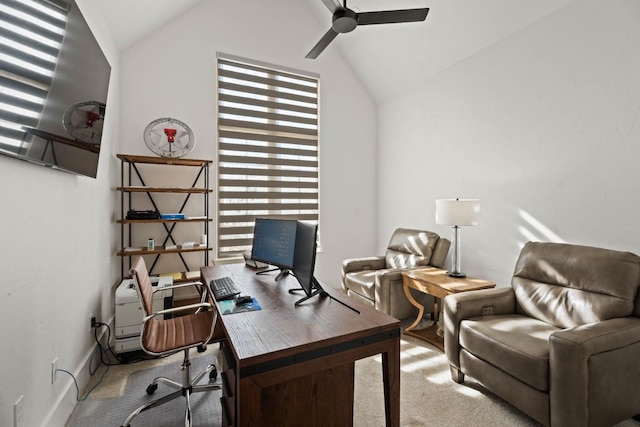 carpeted home office featuring vaulted ceiling and ceiling fan