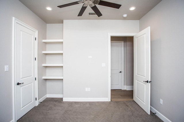 unfurnished bedroom with carpet, baseboards, and recessed lighting