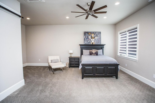 carpeted bedroom with recessed lighting, visible vents, a barn door, ceiling fan, and baseboards