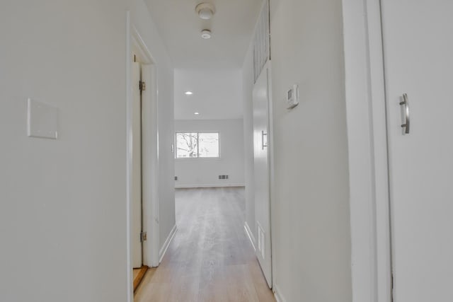 hallway with light wood-type flooring