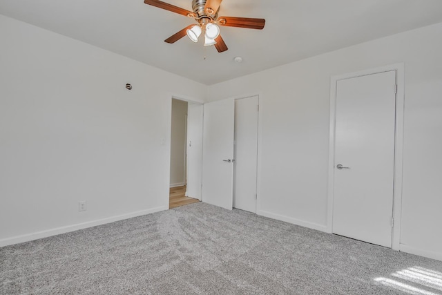 unfurnished bedroom with light carpet and ceiling fan