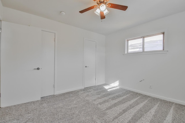 unfurnished bedroom with carpet floors and ceiling fan