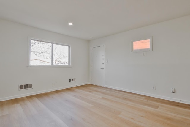 spare room featuring light wood-type flooring