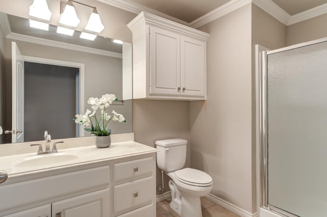 bathroom with vanity, crown molding, a shower with shower door, and toilet