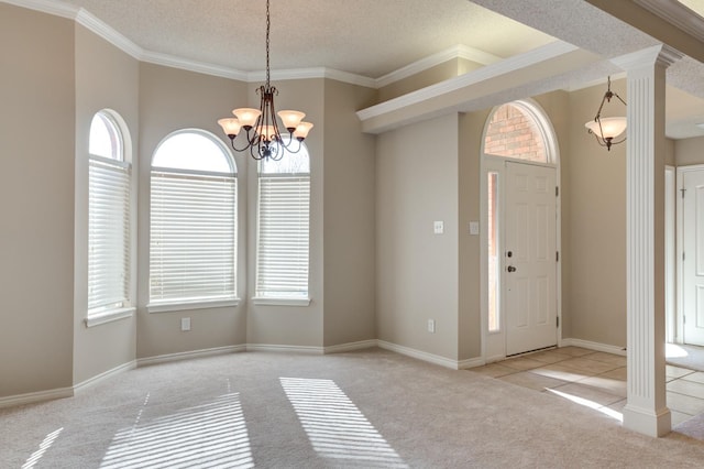 foyer featuring ornamental molding, plenty of natural light, and light colored carpet