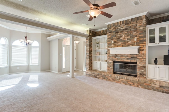 unfurnished living room featuring crown molding, plenty of natural light, and a textured ceiling