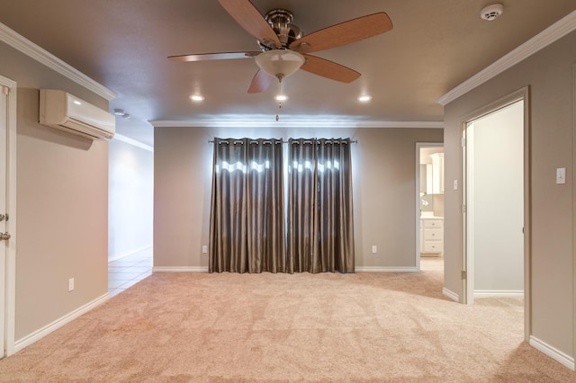 spare room featuring crown molding, light colored carpet, ceiling fan, and a wall unit AC