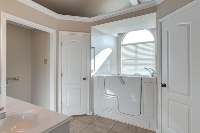 bathroom featuring ornamental molding, tile patterned floors, and vanity