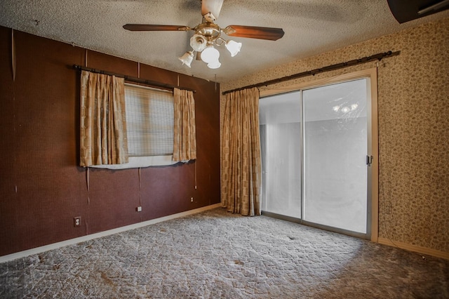 unfurnished bedroom with ceiling fan, carpet flooring, a textured ceiling, and a closet