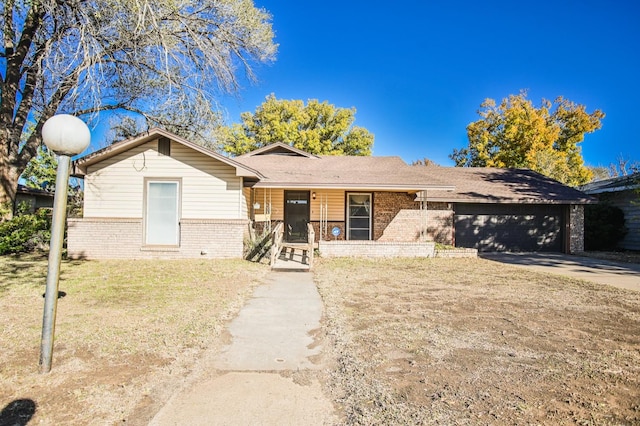 ranch-style home with a garage and a front yard