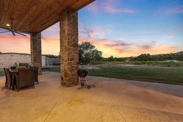 patio terrace at dusk with a lawn