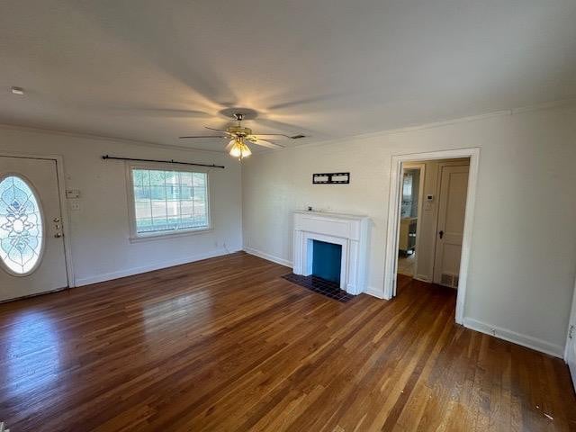 unfurnished living room with dark wood-type flooring and ceiling fan